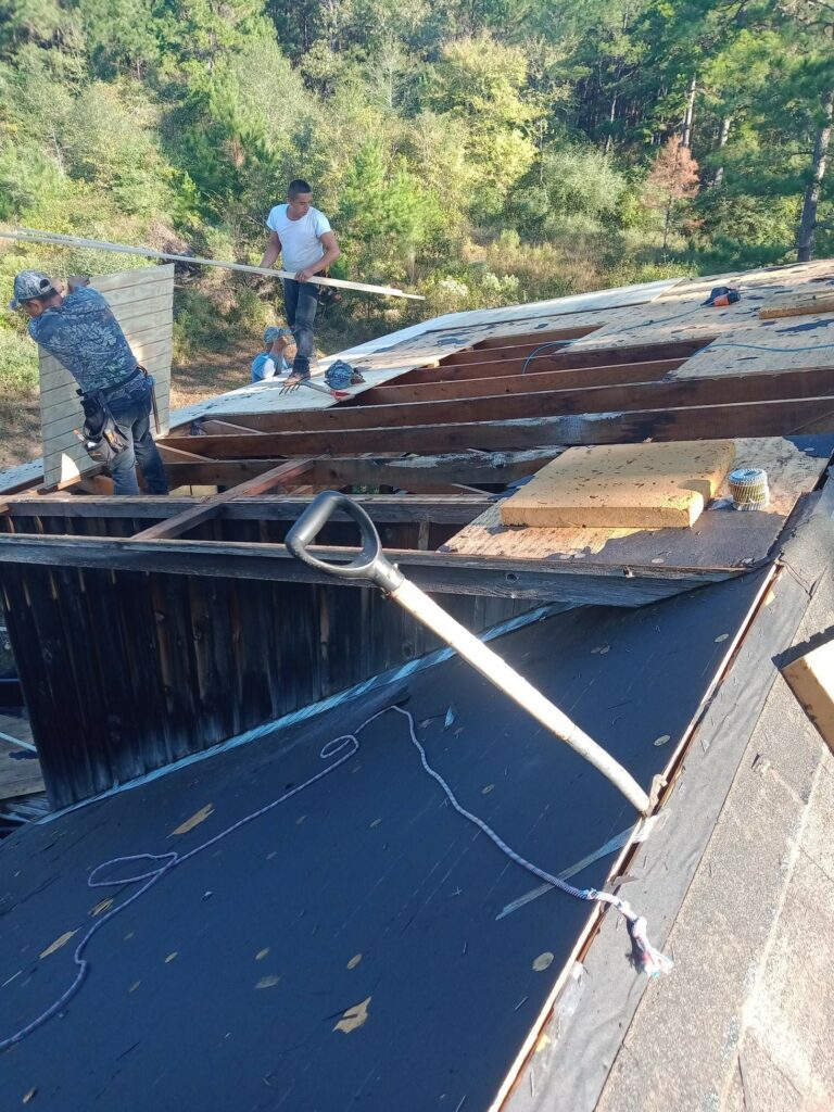 Top of roof image of Grumbles team removing roof
